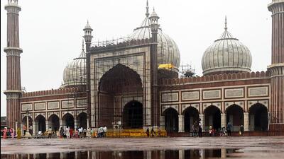 A reflection of Jama Masjid in a puddle of water amid a light spell of rain, in New Delhi on Sunday. (ANI)