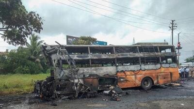 Charred remains of a bus after it hit a truck and caught fire on Aurangabad Road in Nashik district, Saturday. (PTI) Charred remains of a bus after it hit a truck and caught fire on Aurangabad Road in Nashik district, Saturday. (PTI)