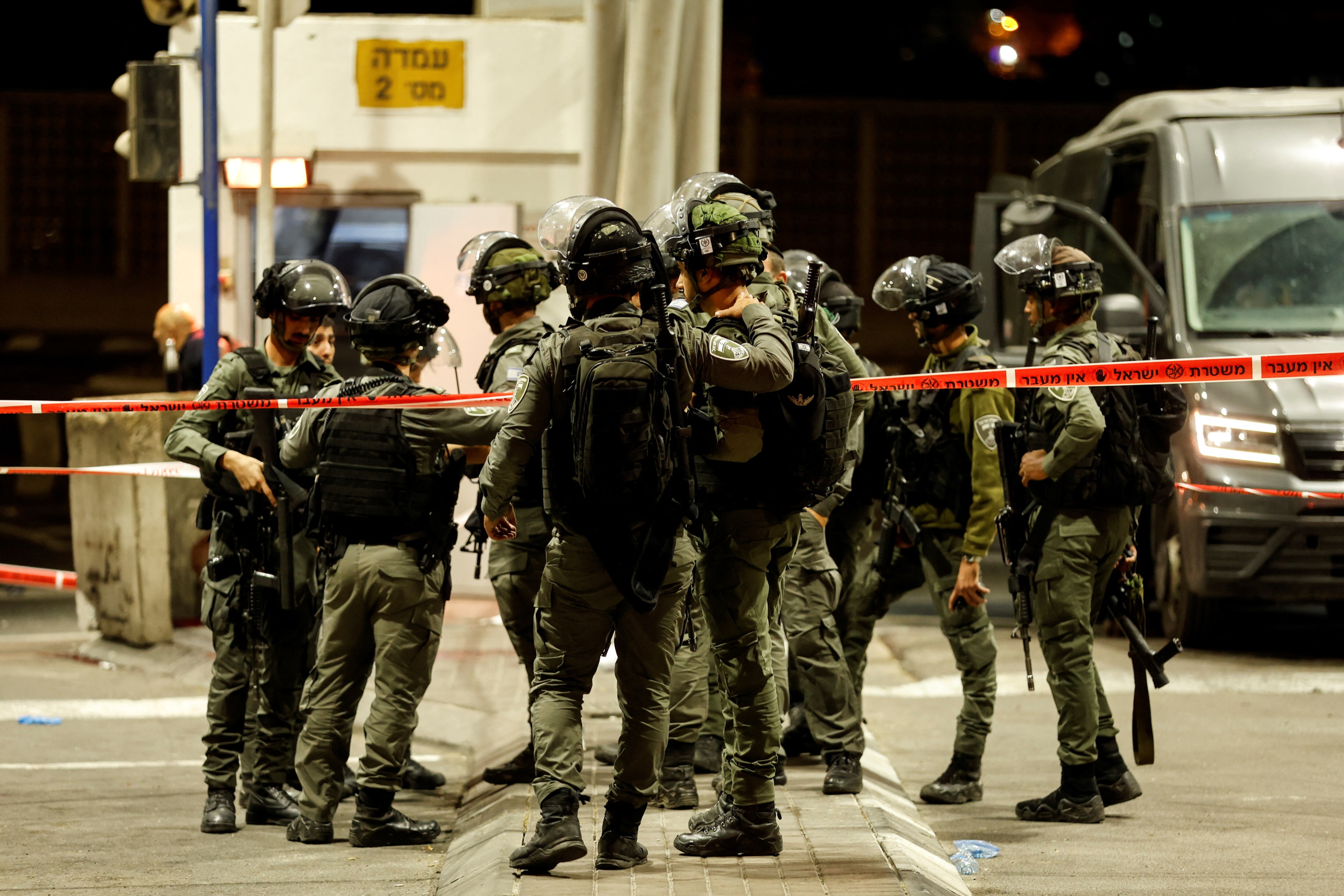 Israeli security forces gather following a shooting incident at a check point in east Jerusalem, Israeli police said October 8, 2022. (REUTERS/Ammar Awad)