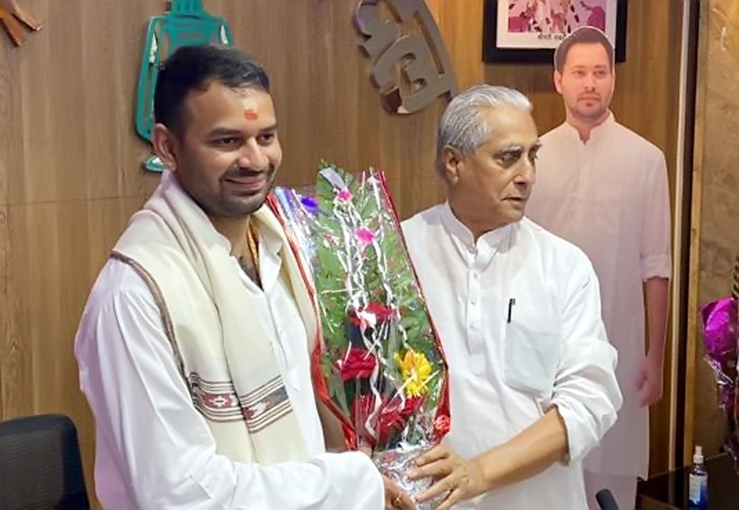 Bihar state RJD president Jagdanand Singh felicitates minister Tej Pratap Yadav at RJD office, in Patna, Bihar, India. (Photo by Santosh Kumar/Hindustan Times)