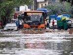 Vehicles wade through a waterlogged road following heavy rainfall, in New Delhi. (ANI Photo) Vehicles wade through a waterlogged road following heavy rainfall, in New Delhi. (ANI Photo)