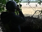A Ukrainian army serviceman stands guard at a position in the northeastern Sumy region.&nbsp;