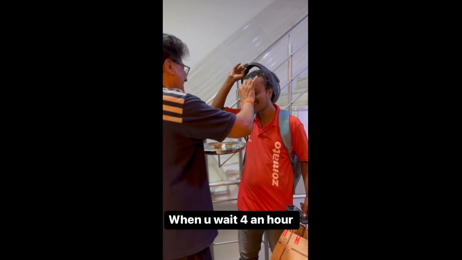 Man greets Zomato delivery executive with 'tilak' after an hour-long delay  | Trending - Hindustan Times