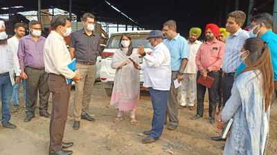 MC commissioner Shena Aggarwal, along with other officials, inspecting the machinery for disposing of legacy waste at main dump site of MC in Ludhiana. (HT PHOTO)