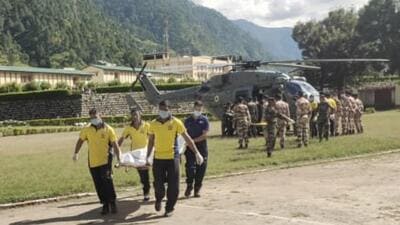 Bodies being brought to Matli in an IAF chopper in Uttarakhand on Monday. (HT Photo)