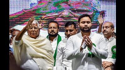 RJD president Lalu Prasad with Bihar deputy chief minister and party leader Tejashwi Prasad Yadav during RJD's national executive meeting in New Delhi on Monday. (PTI)