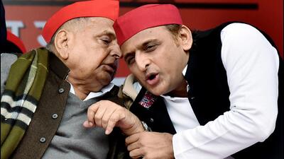 Former Uttar Pradesh chief minister and Samajwadi Party founder Mulayam Singh Yadav with son Akhilesh at a public event. (ANI File Photo)