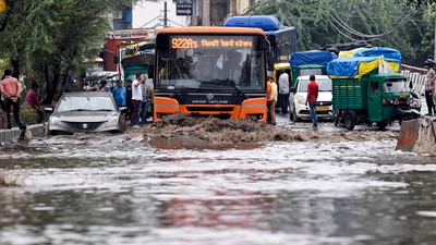 Vehicles wade through a waterlogged road following heavy rainfall, in New Delhi. (ANI Photo) Vehicles wade through a waterlogged road following heavy rainfall, in New Delhi. (ANI Photo)