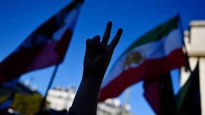 Iran Anti-Hijab Protests: Demonstrator gestures a peace sign during a rally. (AFP) Iran Anti-Hijab Protests: Demonstrator gestures a peace sign during a rally. (AFP)