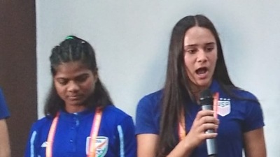 Mia Bhuta (right), USA player of Indian origin, with Indian team captain Astam Oraon in Bhubaneshwar on Monday.