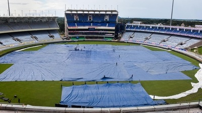 Ground staff use a tarpaulin sheet to cover the field ahead of the 2nd ODI cricket match between India and South Africa (PTI) Ground staff use a tarpaulin sheet to cover the field ahead of the 2nd ODI cricket match between India and South Africa (PTI)
