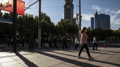 Covid In China: Pedestrians in Shanghai, China. (Bloomberg) Covid In China: Pedestrians in Shanghai, China. (Bloomberg)