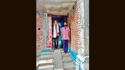 Mahadev Kurre and his son Juneshwar in Kaitha village. (HT Photo) Mahadev Kurre and his son Juneshwar in Kaitha village. (HT Photo)