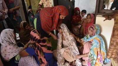 Relatives console the grieving mother of one of the six children who drowned on Sunday in a temporary water body near Shankar Vihar Colony, in Sector 110, Gurugram. (Vipin Kumar/HT Photo) Relatives console the grieving mother of one of the six children who drowned on Sunday in a temporary water body near Shankar Vihar Colony, in Sector 110, Gurugram. (Vipin Kumar/HT Photo)