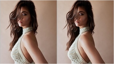 Keerthy's dress features a high-rise halter neckline, a plunging back, a figure-hugging silhouette accentuating her curves, a floor-sweeping train on the back, and a thigh-high slit on the side displaying her long legs. (Instagram) Keerthy's dress features a high-rise halter neckline, a plunging back, a figure-hugging silhouette accentuating her curves, a floor-sweeping train on the back, and a thigh-high slit on the side displaying her long legs. (Instagram)