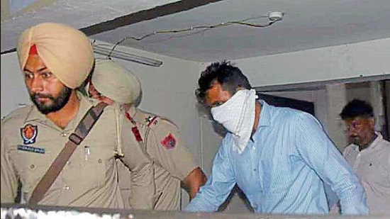 One of the accused being taken to the courtroom for sentencing in Ludhiana on Monday. (Harvinder Singh/HT) One of the accused being taken to the courtroom for sentencing in Ludhiana on Monday. (Harvinder Singh/HT)