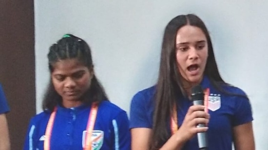 Mia Bhuta (right), USA player of Indian origin, with Indian team captain Astam Oraon in Bhubaneshwar on Monday.