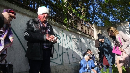 Russia-Ukraine War: People receive medical treatment at the scene of Russian shelling, in Kyiv, Ukraine.(AP) Russia-Ukraine War: People receive medical treatment at the scene of Russian shelling, in Kyiv, Ukraine.(AP)