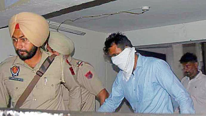 One of the accused being taken to the courtroom for sentencing in Ludhiana on Monday. (Harvinder Singh/HT) One of the accused being taken to the courtroom for sentencing in Ludhiana on Monday. (Harvinder Singh/HT)