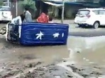 An e-rickshaw topples in UP's Sitapur due to potholes. Convoy of officials pass by it but do not stop, shows a viral video.&nbsp;