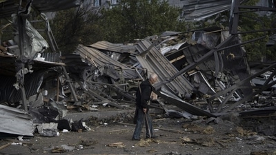 Russia-Ukraine War: An elderly man walks past a car shop that was destroyed after a Russian attack in Zaporizhzhia, Ukraine. (AP)