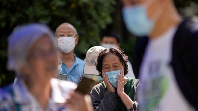 Covid In China: People line up to get tested for Covid at a nucleic acid testing site in China. (Reuters)