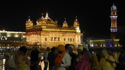 Devotees gather to pay respect on the eve of the birth anniversary of the fourth Sikh Guru Ramdas at the illuminated Golden Temple in Amritsar on October 10. (AFP) Devotees gather to pay respect on the eve of the birth anniversary of the fourth Sikh Guru Ramdas at the illuminated Golden Temple in Amritsar on October 10. (AFP)