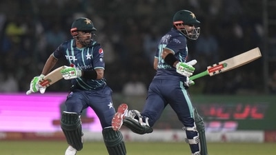 Babar Azam, left, and batting partner Mohammad Rizwan run between the wickets. (AP) Babar Azam, left, and batting partner Mohammad Rizwan run between the wickets. (AP)