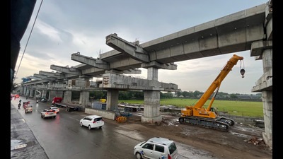 Work underway at Khadki metro station on old Pune-Mumbai highway, on Tuesday. (HT PHOTO)
