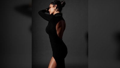 Esha Gupta's silhouette features a turtle neckline, long sleeves with inserted gloves that the hand can be taken out of, a silhouette shaped cut to show off your curves, and a split on one leg. (Instagram/@egupta)