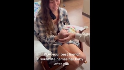 The image shows the woman's reaction when she learns that her best friend named her newborn after her. (Instagram/@tanksgoodnews) The image shows the woman's reaction when she learns that her best friend named her newborn after her. (Instagram/@tanksgoodnews)