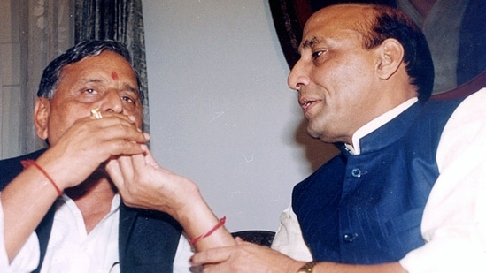 File photo of former Uttar Pradesh chief minister Mulayam Singh Yadav with BJP leader Rajnath Singh. (ANI Photo)
