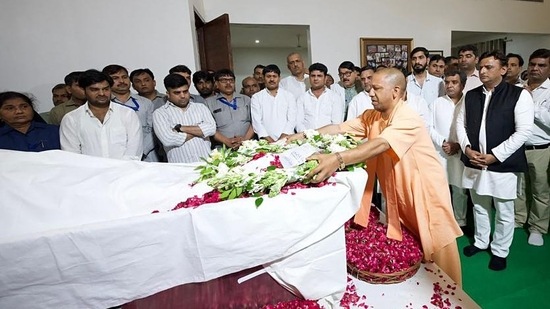 Uttar Pradesh chief minister Yogi Adityanath pays last respect to the mortal remains of Mulayam Singh Yadav in Saifai. (ANI/Samajwadi Party Twitter)