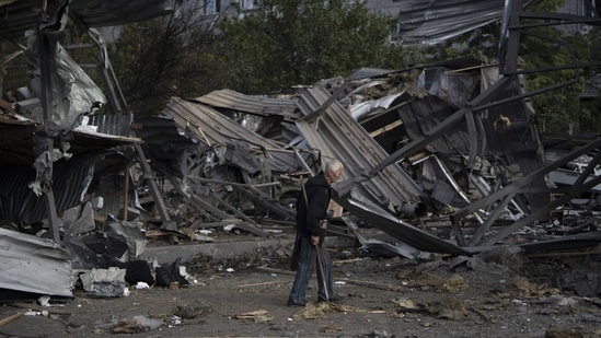 Russia-Ukraine War: An elderly man walks past a car shop that was destroyed after a Russian attack in Zaporizhzhia, Ukraine.(AP)