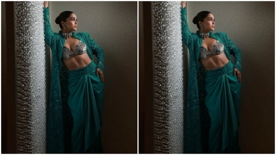 Sharvari looked sassy as ever in a silver leather bralette with a plunging neckline. She added more glam to her look with a green shrug with lace details throughout. In a green satin long skirt with ace details at the waist, she completed her look.(Instagram/@sharvari)