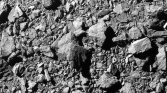 This picture provided by NASA shows the last complete image of asteroid moonlet Dimorphos, taken by the DRACO imager on NASA's Double Asteroid Redirection Test (DART) mission from approximately 7 miles (12 kilometers) from the asteroid and 2 seconds before impact. -(AFP) This picture provided by NASA shows the last complete image of asteroid moonlet Dimorphos, taken by the DRACO imager on NASA's Double Asteroid Redirection Test (DART) mission from approximately 7 miles (12 kilometers) from the asteroid and 2 seconds before impact. -(AFP)