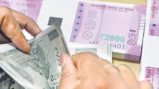 On Monday, the rupee slipped 10 paise to finish at a fresh lifetime low of 82.40.(AFP file photo) On Monday, the rupee slipped 10 paise to finish at a fresh lifetime low of 82.40.(AFP file photo)