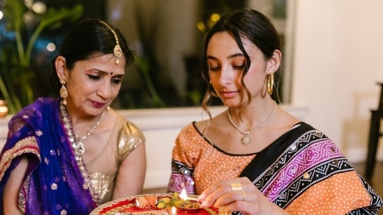 Women come together to listen to Vrat Katha.