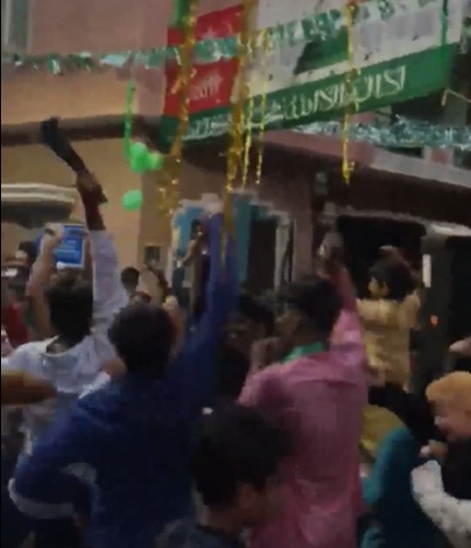 The men were seen dancing with swords and other weapons. (Screengrab of video) The men were seen dancing with swords and other weapons. (Screengrab of video)