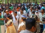 Police and locals at the place where two women were murdered and buried in a horrific case of black magic and human sacrifice at Elanthoor in Pathanamthitta district. (PTI) Police and locals at the place where two women were murdered and buried in a horrific case of black magic and human sacrifice at Elanthoor in Pathanamthitta district. (PTI)