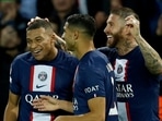 Paris St Germain's Kylian Mbappe celebrates scoring their first goal with Achraf Hakimi and Sergio Ramos
