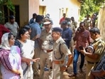Kochi Police and locals at the place where two women were allegedly murdered and buried in a case of black magic and human sacrifice at Elanthoor in Pathanamthitta district of Kerala on Tuesday (PTI) Kochi Police and locals at the place where two women were allegedly murdered and buried in a case of black magic and human sacrifice at Elanthoor in Pathanamthitta district of Kerala on Tuesday (PTI)
