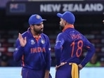 Rohit Sharma and Virat Kohli chat during a match