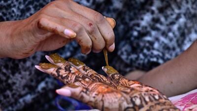 With the demand high, many professional mehendi artists were charging as much as ₹1,100-1,500 per hand for regular designs and up to ₹10,000 for customised designs. (Gurpreet Singh/HT) With the demand high, many professional mehendi artists were charging as much as ₹1,100-1,500 per hand for regular designs and up to ₹10,000 for customised designs. (Gurpreet Singh/HT)