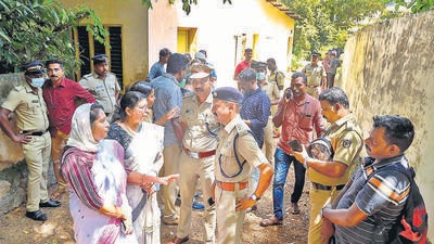 Police and locals at the place where two women were allegedly murdered and buried in a case of black magic and human sacrifice at Elanthoor in Pathanamthitta district of Kerala, Tuesday, Oct 11, 2022. (PTI) Police and locals at the place where two women were allegedly murdered and buried in a case of black magic and human sacrifice at Elanthoor in Pathanamthitta district of Kerala, Tuesday, Oct 11, 2022. (PTI)