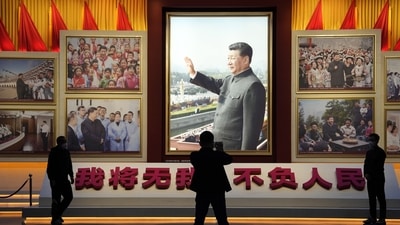 A portrait of Chinese President Xi Jinping is displayed near the words that means "I will put aside my own well-being for the good of my People" at the Museum of the Communist Party of China in Beijing, Wednesday. (AP) A portrait of Chinese President Xi Jinping is displayed near the words that means "I will put aside my own well-being for the good of my People" at the Museum of the Communist Party of China in Beijing, Wednesday. (AP)