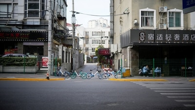 Shanghai Water Shortage: An entrance is blocked by bicycles from a bike-sharing service at a sealed area in Shanghai, China. (Reuters)