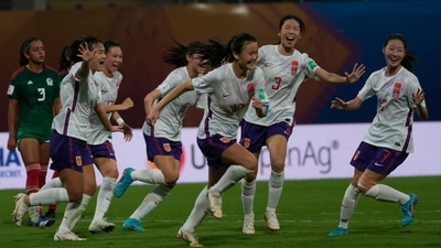 China's Qiao Ruiqi celebrates along with her team members after scoring a goal against Mexico (AP)