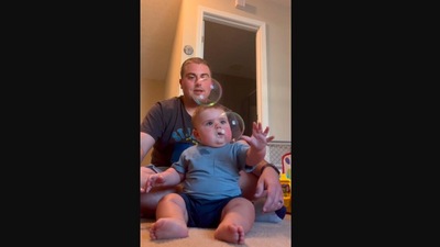The image, taken from the Instagram video, shows a baby’s reaction to seeing bubbles for the first time. (Instagram/@goodnews_movement)