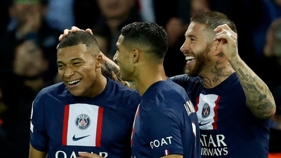 Paris St Germain's Kylian Mbappe celebrates scoring their first goal with Achraf Hakimi and Sergio Ramos (REUTERS)